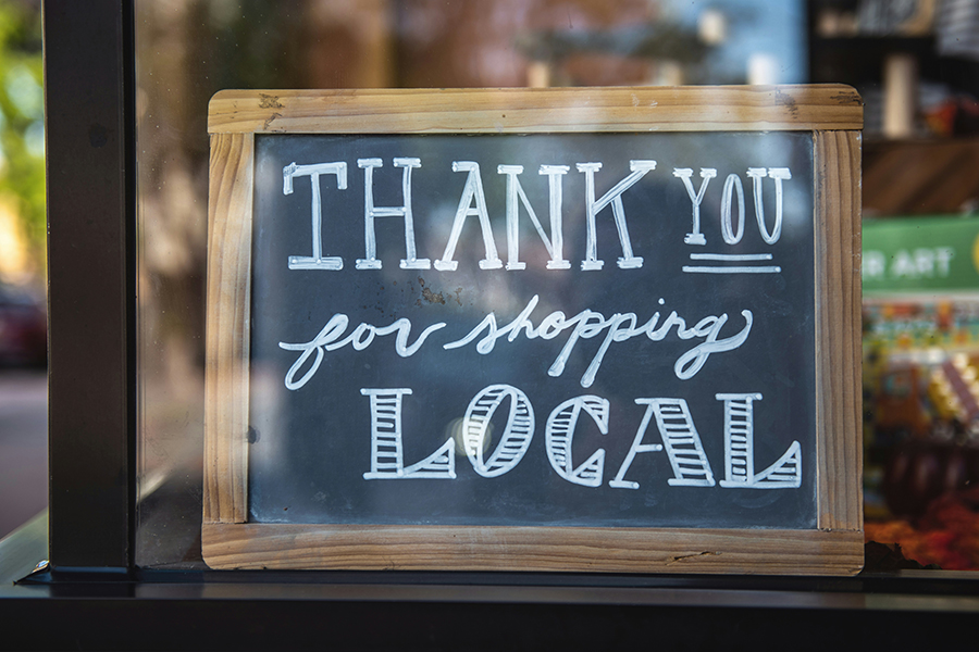 Image that displays a sign that says "Thank you for shopping local"