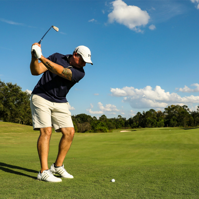 person golfing